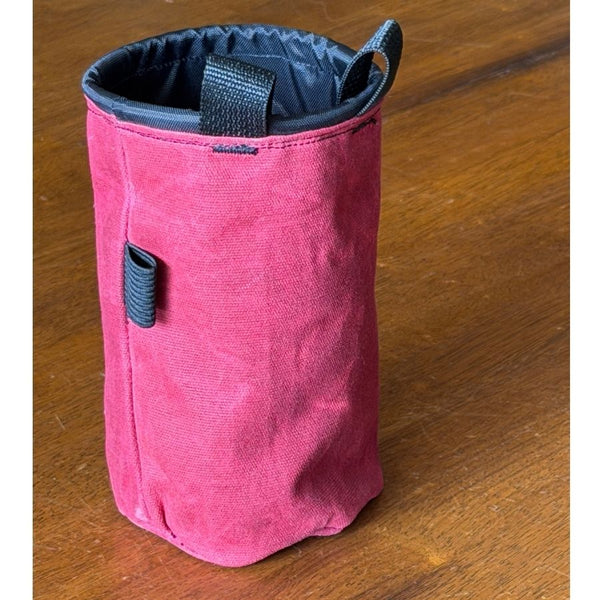 Side view of the maroon GHS Climbing waxed canvas chalk bag showing stitching and a black tool loop.