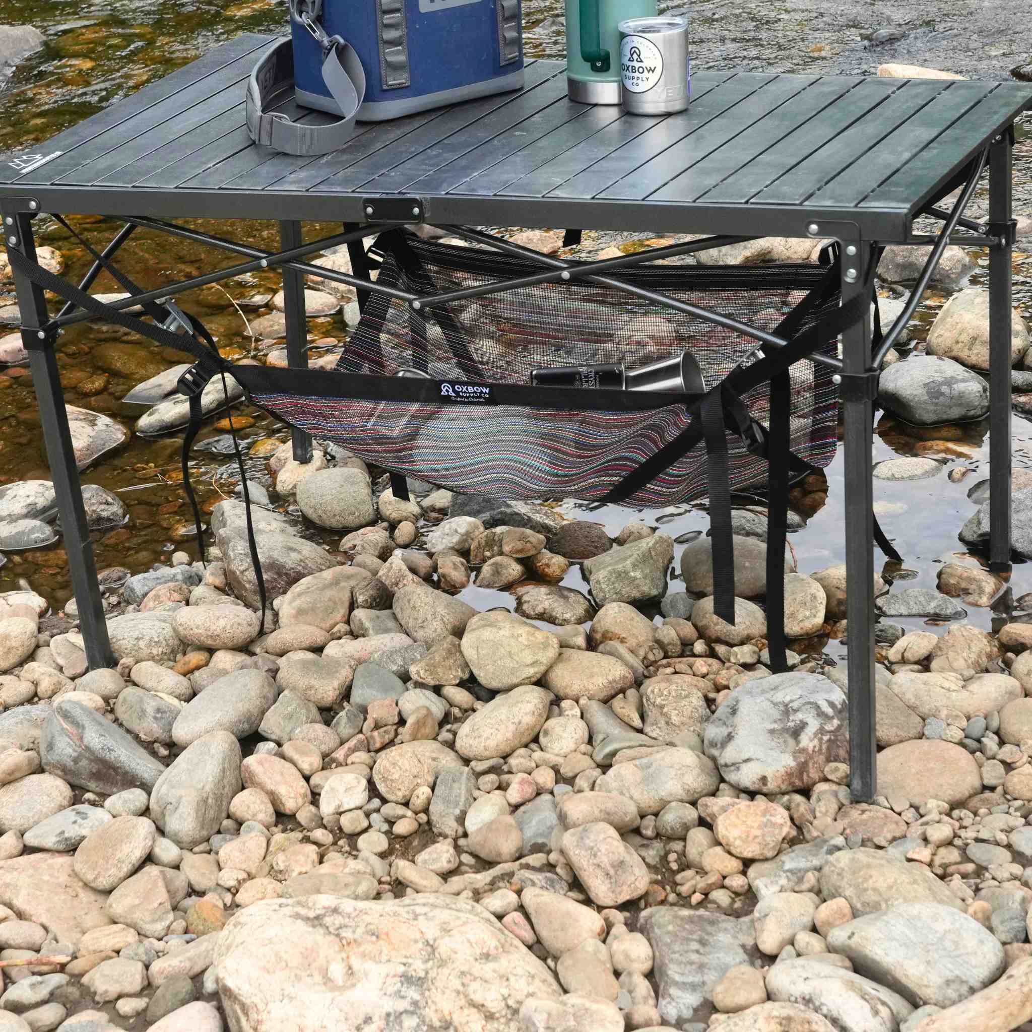 Table Sling doubling storage capacity beneath camp table