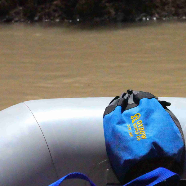 Bow line bag mounted on whitewater raft frame