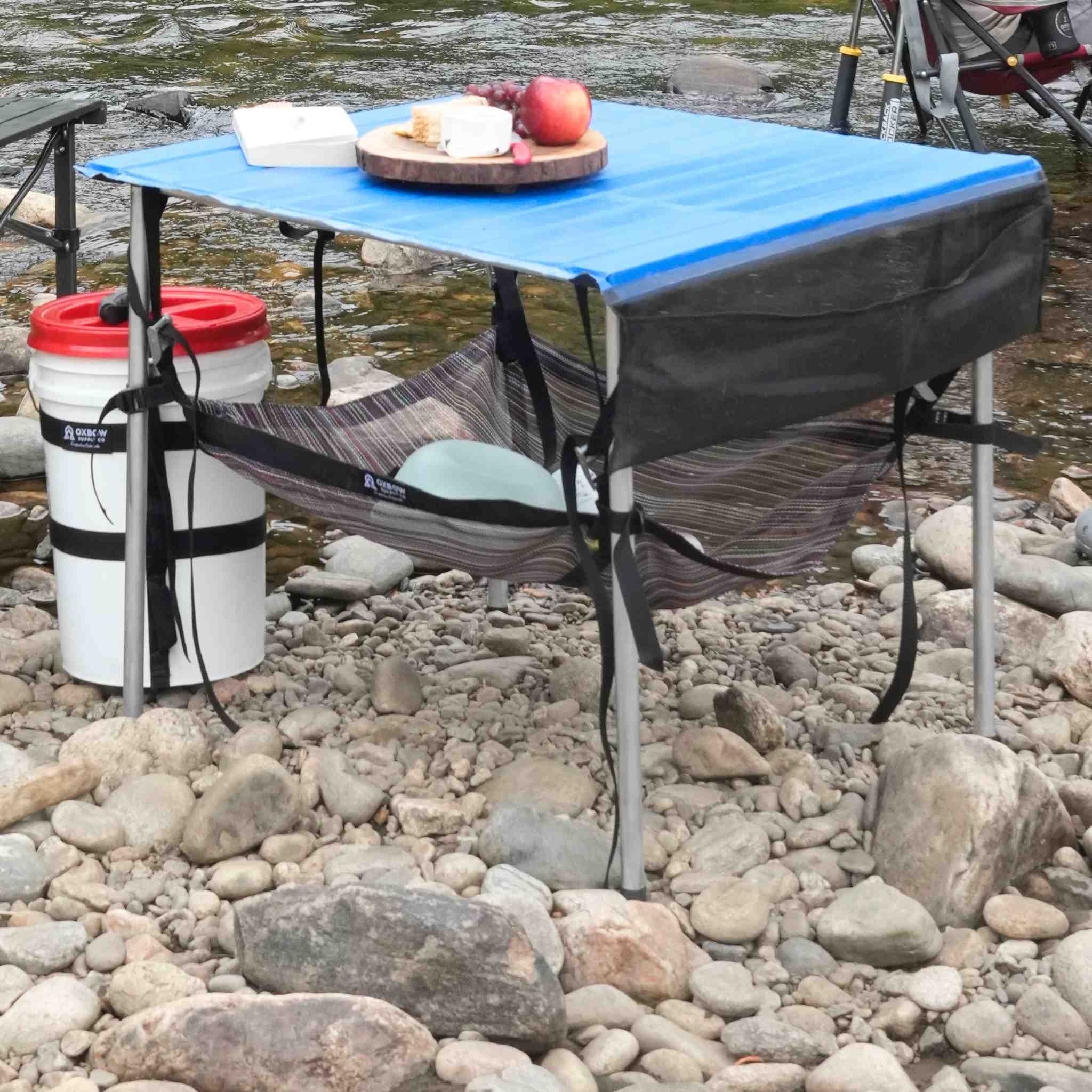 Table Sling suspended storage system for rafting camp