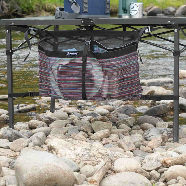 Under-table organizer with large storage pocket for camp gear