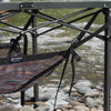 Camp table storage shelf keeping gear off the ground